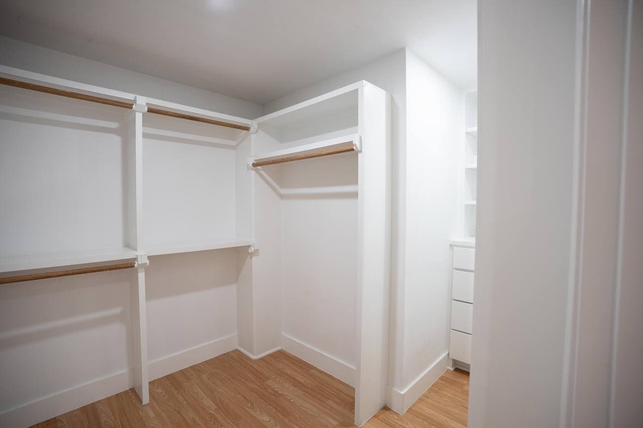 Walk-in closet build-out with custom shelving system