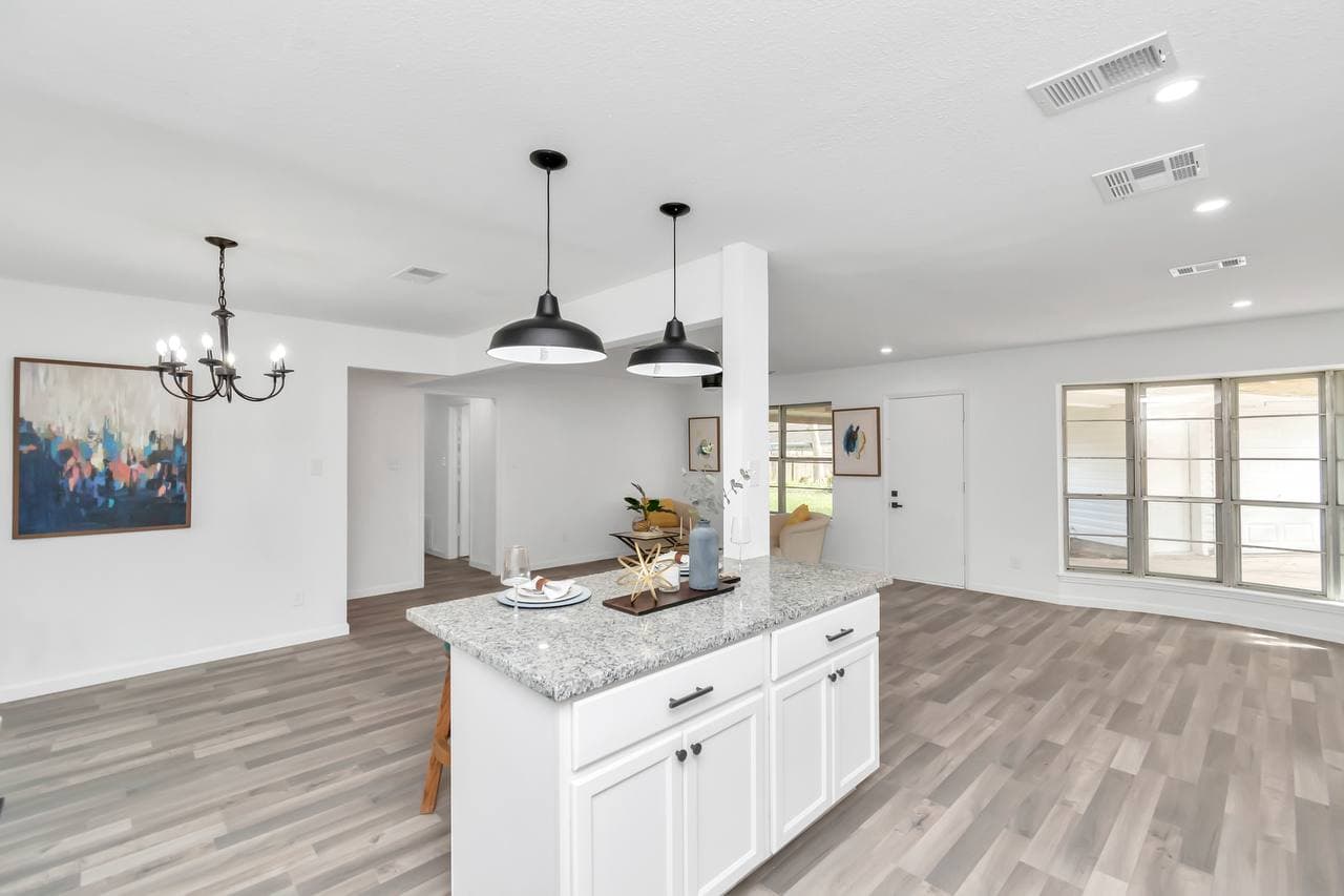 Kitchen remodel with island seating and new hardwood floors